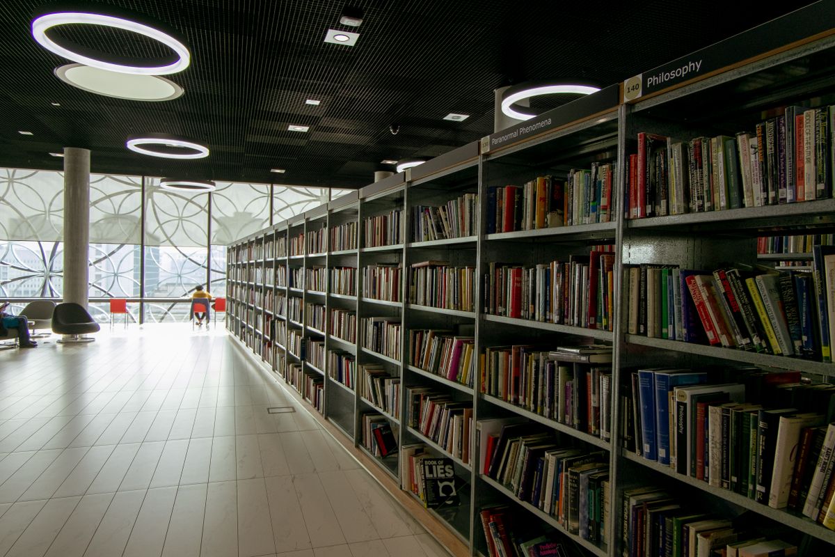 A bright, modern library interior with bookshelves