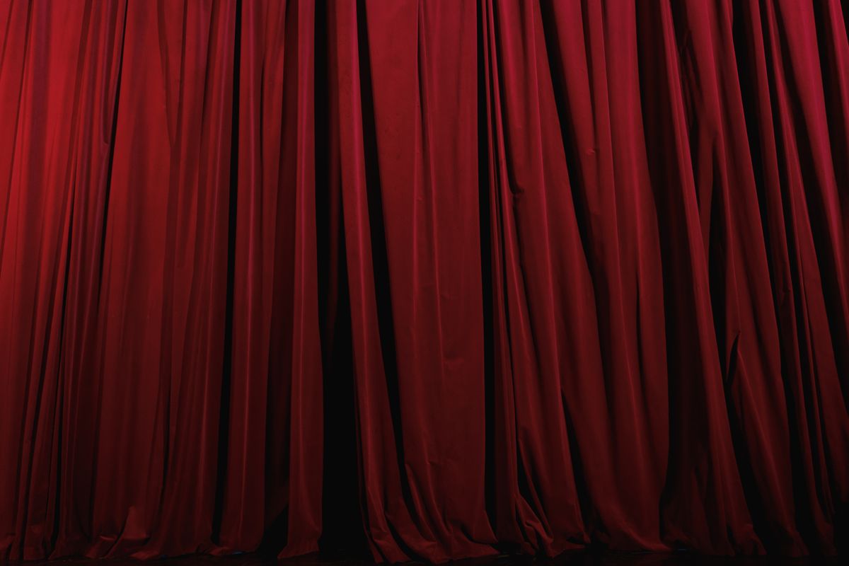 A deep red theatre curtain